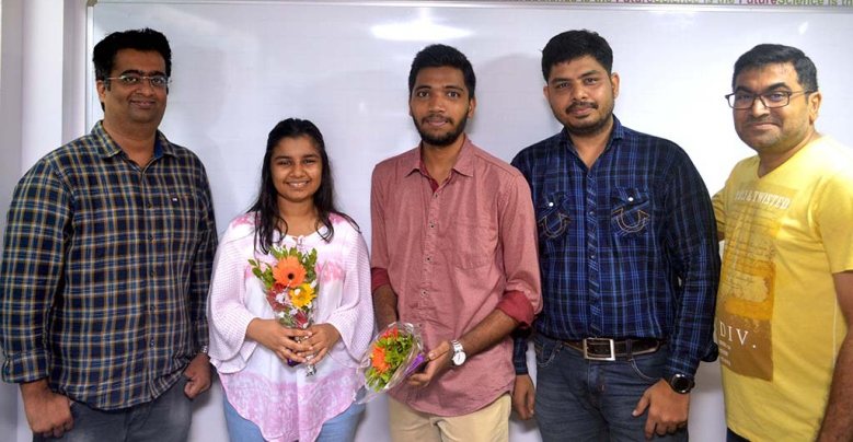 Toppers felicitated with flowers by their mentors